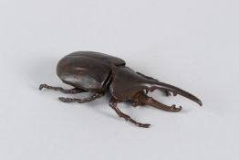 A JAPANESE ARTICULATED RHINOCEROS BEETLE. 11cms long.