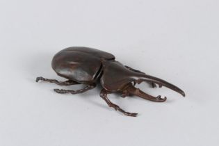 A JAPANESE ARTICULATED RHINOCEROS BEETLE. 11cms long.