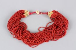AN ISLAMIC TURKISH CORAL BEAD KOLYE. 54cms long.