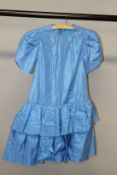 A PALE BLUE SATIN DRESS.