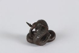 A JAPANESE BRONZE SNAKE. 1.5cms high.