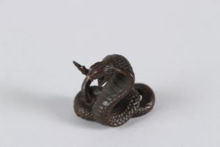 A JAPANESE BRONZE SNAKE. 1.5cms high.