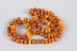 AN ISLAMIC TURKISH AMBER BEAD KOLYE. 92cms long.