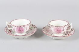 A PAIR OF SMALL LUSTRE WARE DECORATED PORCELAIN CUPS AND SAUCERS.