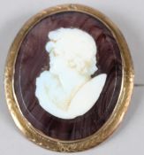 A YELLOW METAL MOUNTED HARDSTONE BROOCH, with portrait bust. 35mm.