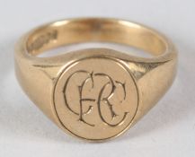 A 9CT GOLD SIGNET RING, engraved with initials. 9gms.