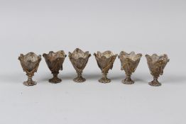 A SET OF SIX INDIAN FILIGREE EGG CUPS. 6cms high.