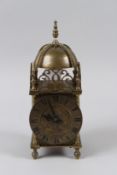 A GOOD SMALL BRASS LANTERN CLOCK with clockwork movement.