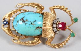 A YELLOW METAL, BUG SHAPED BROOCH, set with diamonds, emeralds, ruby, sapphire and turquoise. 5cms