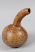 A CALABASH GOURD etched with a boat, figures and donkey. 23cms high.