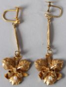 A PAIR OF YELLOW METAL AND PEARL LEAF SHAPE EARRINGS. 5gms.