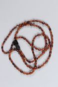 A VERY LONG HORN STRING OF BEADS. 170cms long