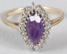 A 9CT GOLD, AMETHYST AND DIAMOND DRESS RING.