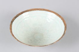 A CHINESE CELADON GLAZED EGGSHELL PORCELAIN BOWL, with incised decoration. 17cms diameter.