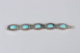 A TIBETAN WHITE METAL BRACELET. 23cms long.