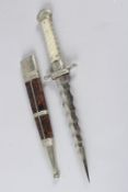 A LATE 19TH CENTURY EUROPEAN DAGGER, with a wavy tapering blade. mother-of-pearl grip, nickel plated