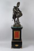 AVANT LE COMBAT. A fine bronze of a drummer boy. 51cms high, on a pedestal base.