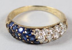 A YELLOW METAL, DIAMOND AND SAPPHIRE RING, of contemporary design.