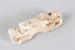AN EGYPTIAN CARVED LIMESTONE USHABTI. 13.5cms long.