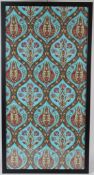 AN OTTOMAN TURKISH ISLAMIC TEXTILE, turquoise ground with stylised embroidered design, framed and