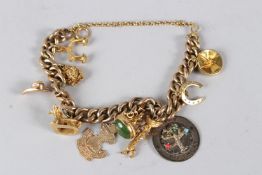 A YELLOW METAL CURBLINK BRACELET, set with various charms. Combined weight 60gms.