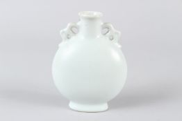 A SMALL CHINESE BLANC DE CHINE MOONFLASK, with pierced handles. 16cms high.