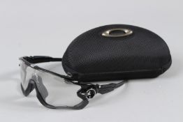 OAKLEY CASED SUNGLASSES.
