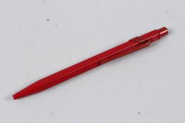 A RED CARAN D'ACHE LIMITED EDITION PEN.