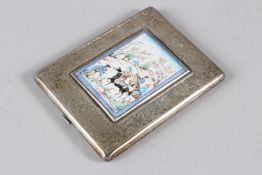 AN INDIAN WHITE METAL CIGARETTE CASE, with engraved decoration and applied enamel plaque with