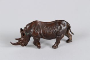 A JAPANESE OKIMONO BRONZE RHINOCEROS. 9cms long.