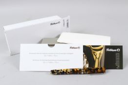 A NEW PELIKAN FOUNTAIN PEN, with box and papers.