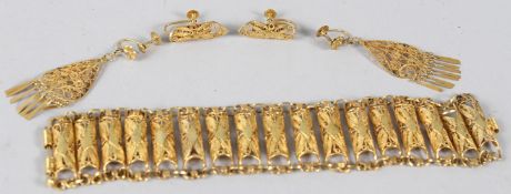 A YELLOW METAL FILIGREE BRACELET, and two pairs of filigree earrings. Combined weight 32gms.