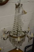 AN ORMOLU AND CUT GLASS CHANDELIER.