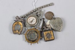 A COLLECTION OF FIVE MINIATURE CHARM COMPASSES.