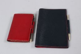 TWO HERMES NOTEBOOKS WITH PENS.