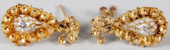 A PAIR OF YELLOW METAL AND DIAMOND LEAF SHAPE EARRINGS. 5gms.