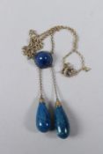 A SILVER AND LAPIS NECKLACE, set with a cabochon lapis stone and a pair of suspended pear shaped