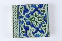 A FINE 16TH - 17TH CENTURY OTTOMAN TURKISH IZNIK TILE. 15cms x 13.5cms