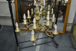 A GOOD BRASS SIX BRANCH, TWELVE LIGHT CHANDELIER.
