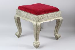 AN INDIAN WHITE METAL MOUNTED STOOL. 44cms x 44cms x 44cms