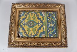 A 19TH CENTURY SAFAVID POTTERY TILE, with similar border tile, both with stylised floral decoration,