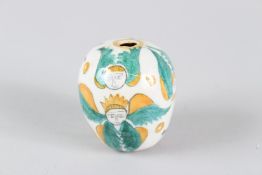 AN OTTOMAN ARMENIAN POTTERY HANGING BALL, KUTAHYA, painted with angelic figures. 7cms high.