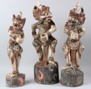 A SET OF THREE 19TH CENTURY INDONESIAN CARVED WOODEN KERIS DAGGER HOLDERS in the form of mythical