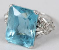 A HIGHLY IMPRESSIVE PLATINUM, DIAMOND AND AQUAMARINE RING, with a 34.70ct rectangular mixed cut