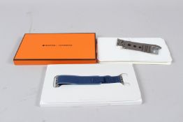 A PAIR OF HERMES BOXED GREY WATCH STRAPS.
