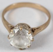 A 9CT GOLD AND CZ SOLITAIRE RING.