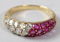 A YELLOW METAL, DIAMOND AND RUBY RING, of contemporary design.