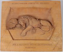 A WOODEN PLAQUE 