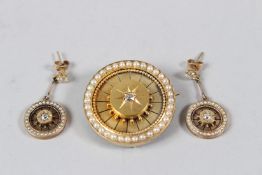 A LATE VICTORIAN / EDWARDIAN YELLOW METAL, DIAMOND AND PEARL TARGET BROOCH, with a pair of