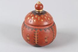A TURKISH TOPHANE POTTERY SUGAR POT AND COVER, with gilded incised decoration. 12cms high.